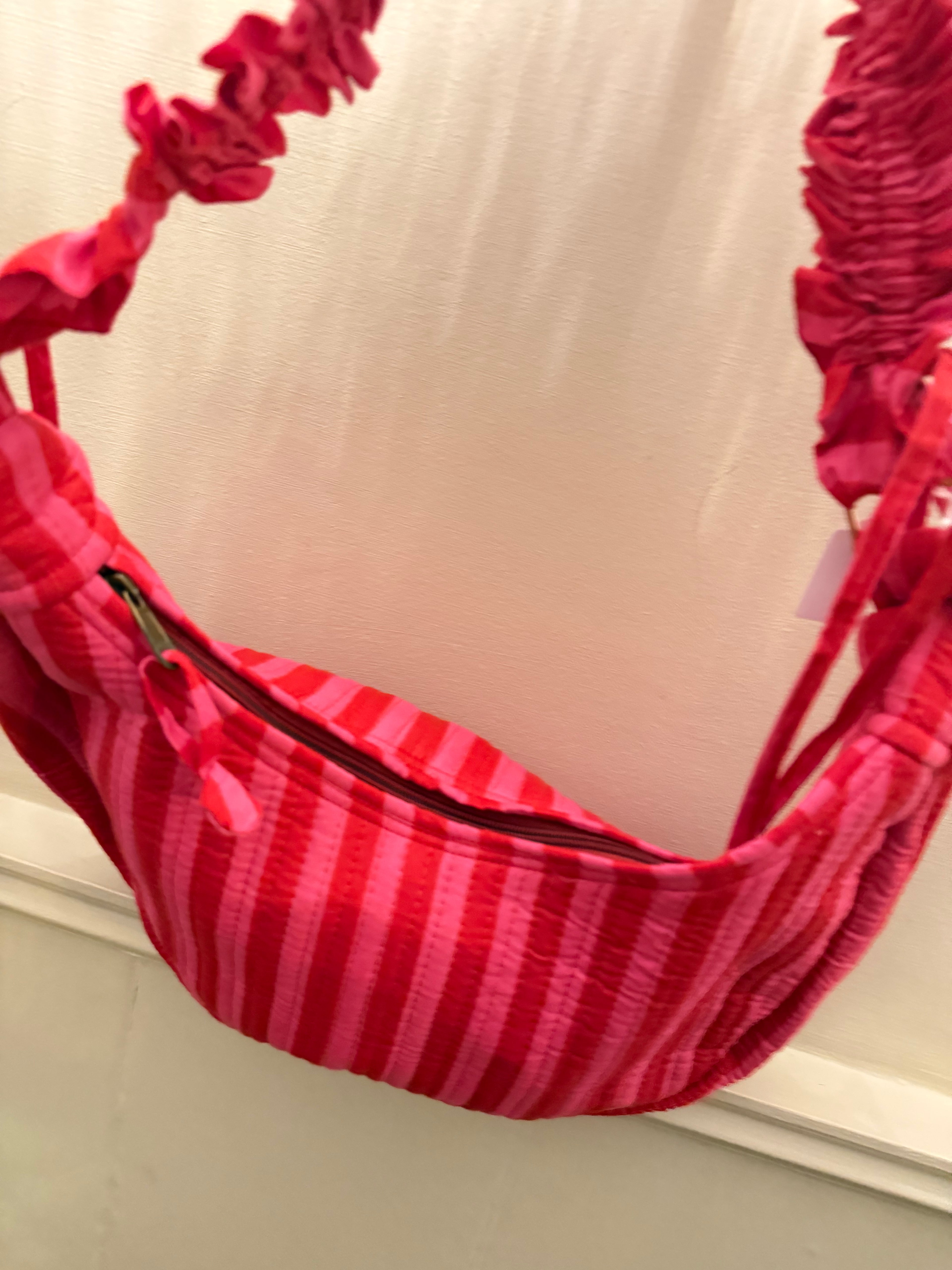 100% Cotton Handmade Frilly handle hand bag with zip closure.
