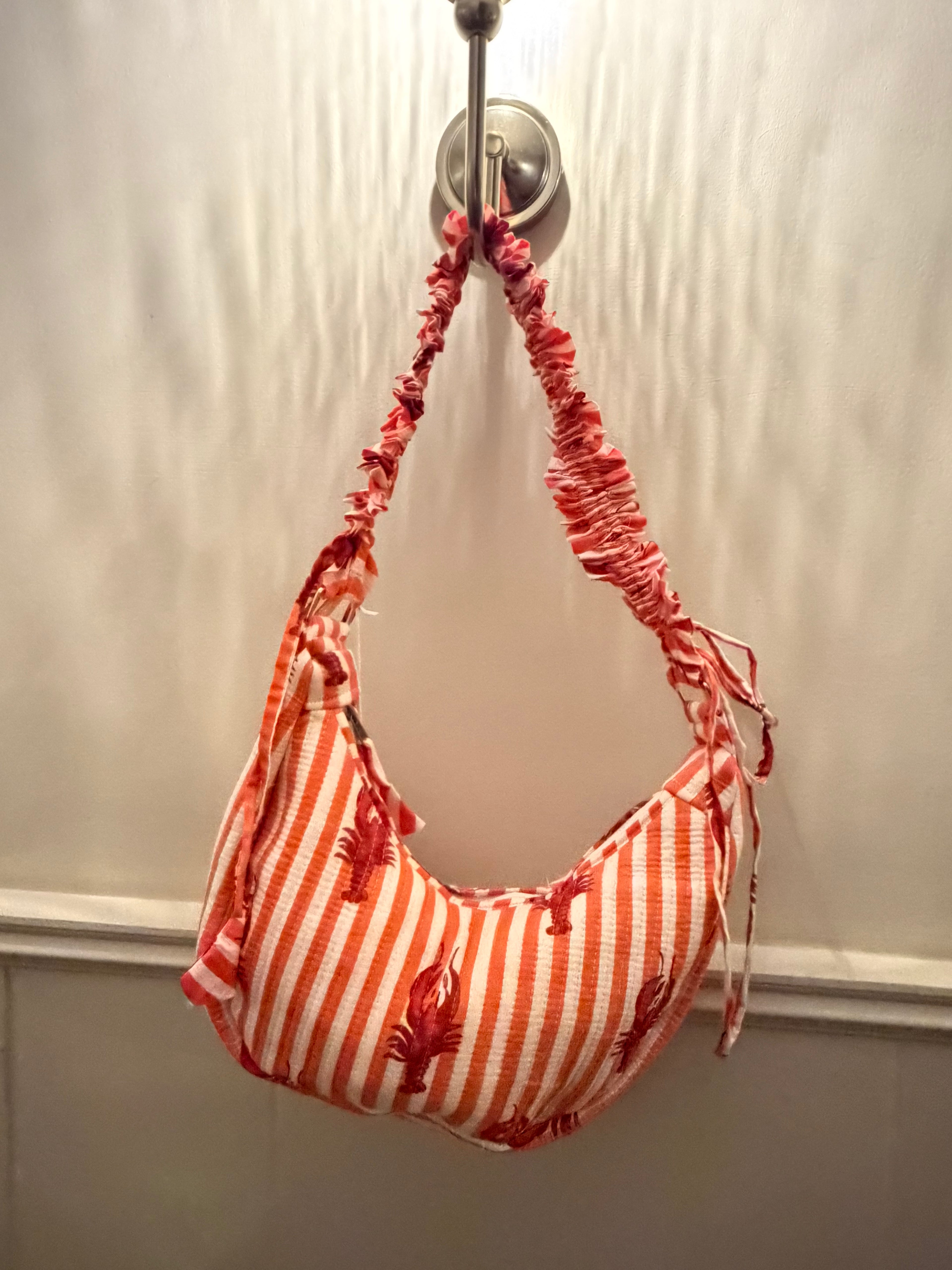100% Cotton Handmade Frilly handle hand bag with zip closure.