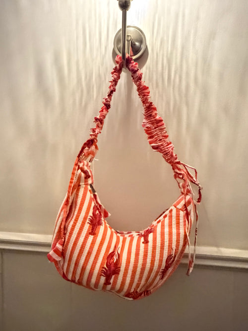 100% Cotton Handmade Frilly handle hand bag with zip closure.