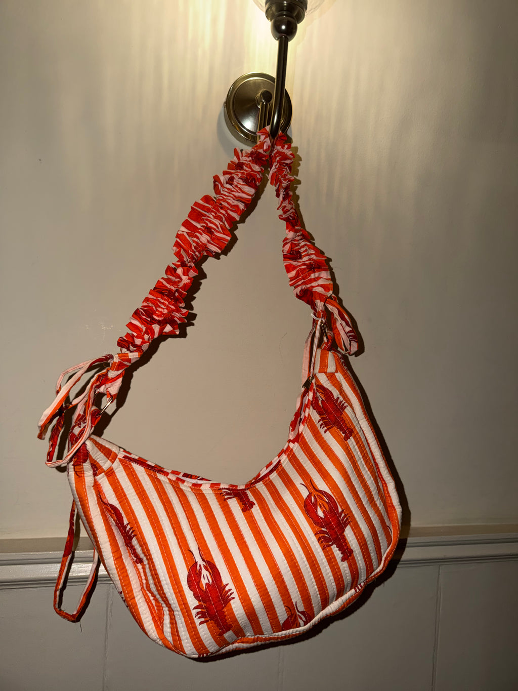 100% Cotton Handmade Frilly handle hand bag with zip closure.