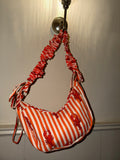 100% Cotton Handmade Frilly handle hand bag with zip closure.
