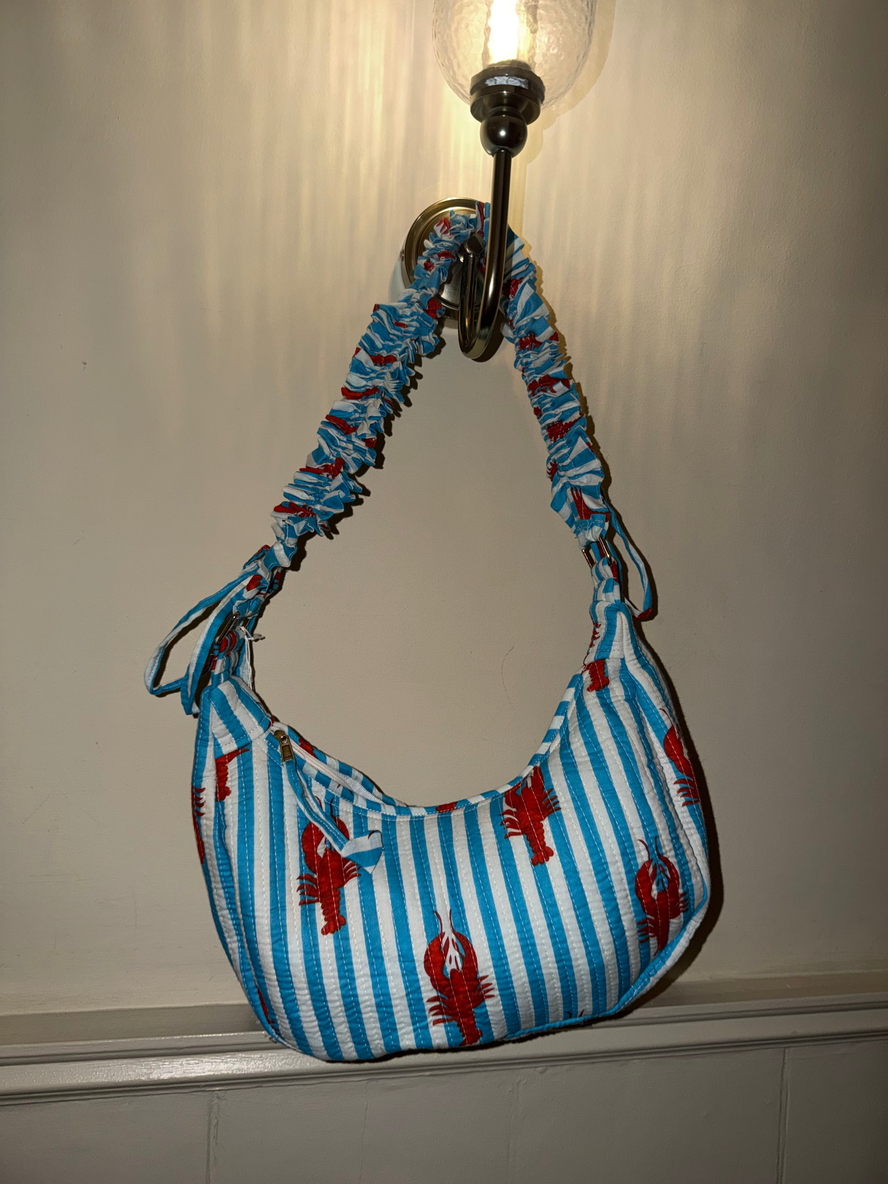 100% Cotton Handmade Frilly handle hand bag with zip closure.