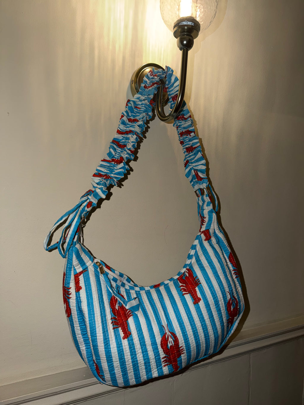 100% Cotton Handmade Frilly handle hand bag with zip closure.
